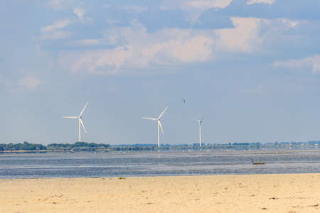 Wind turbines at Dzharylhach bay of the Black sea in Lazurne, Ukraine. Renewable energyの写真素材