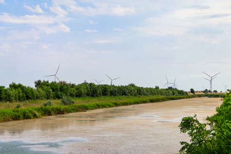 View of wind turbines and North Crimean Canal in Kherson region, Ukraine. Wind power station....