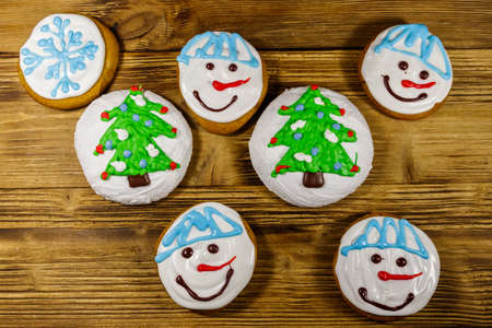 Christmas gingerbread cookies on a wooden background. Top view