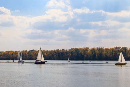 Yachts at sailing regatta on the Dnieper river in Kremenchug, Ukraineの写真素材