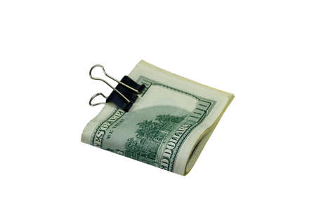 Bundle of bills of american one hundred dollars in paper clip isolated on white background