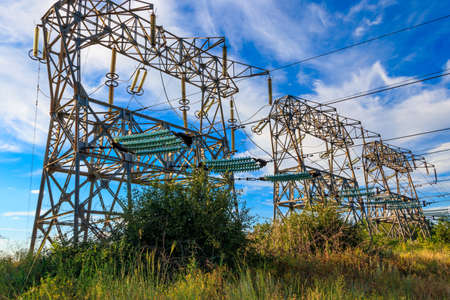 High voltage power line against blue sky
