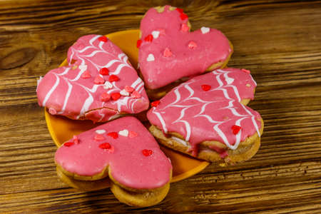 Heart shaped cookies on wooden table. Dessert for valentine day