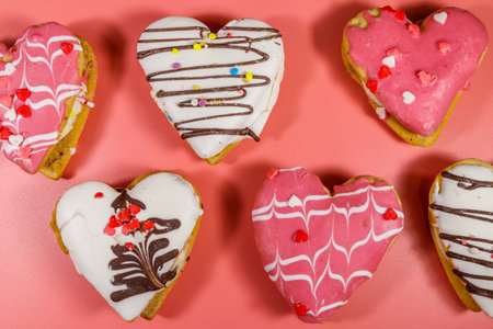 Heart shaped cookies on wooden table. Top view. Dessert for valentine dayの写真素材
