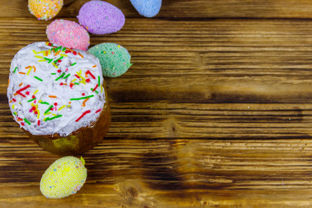 Easter cake and easter eggs on a wooden table. Top view, copy spaceの写真素材