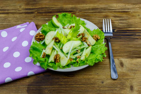 Waldorf salad on a wooden tableの写真素材