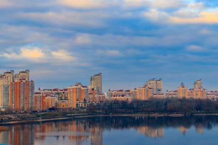 View of Obolon embankment of the Dnieper river and church of the Nativity of Christ in Kiev, Ukraineの写真素材