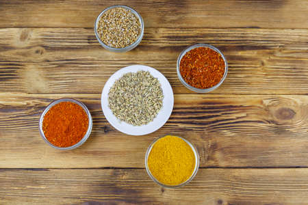 Set of different aromatic spices on wooden table. Top viewの写真素材
