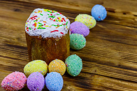 Easter cake and easter eggs on a wooden table