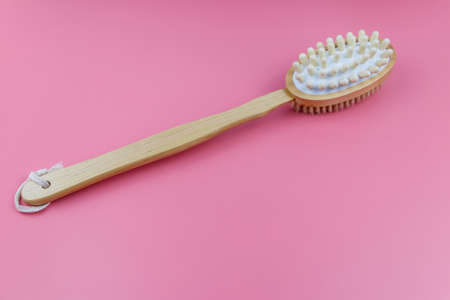 Massage brush on a pink backgroundの写真素材