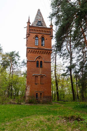 Old brick water tower in Natalyevka park in Kharkiv region, Ukraineの写真素材
