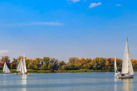 Yachts at sailing regatta on the Dnieper river in Kremenchug, Ukraineの写真素材