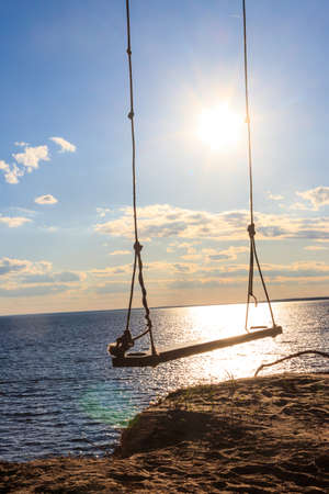 Rope swing on a shore of the Dnieper river in Ukraineの写真素材