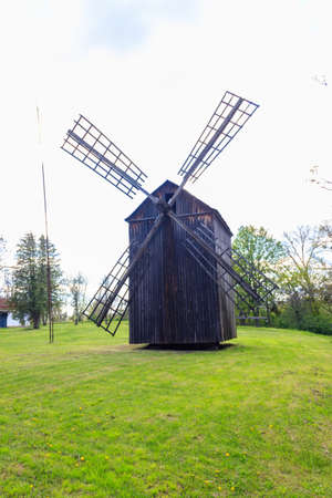 Old wooden windmill in Open-air Museum of Folk Architecture and Folkways of Middle Naddnipryanschina...