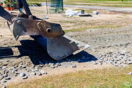 Close-up of bulldozer scoop on a road construction site