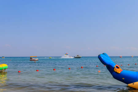 Lazurne, Ukraine - July 18, 2020: Unknown people having fun in the Black sea in Lazurne, Ukraine