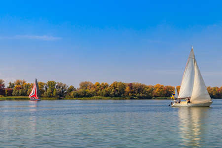 Yachts at sailing regatta on the Dnieper river in Kremenchug, Ukraineの写真素材