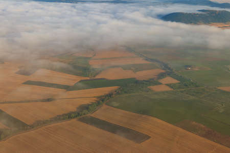 Aerial view of the mountains and fields in Bulgaria. View from a planeの写真素材