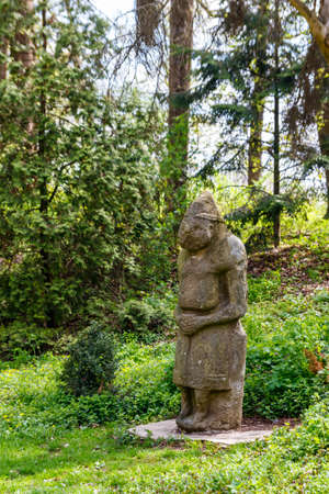 Ancient stone statue of the scythian warrior in the Krasnokutsk park, Kharkiv region, Ukraineの写真素材