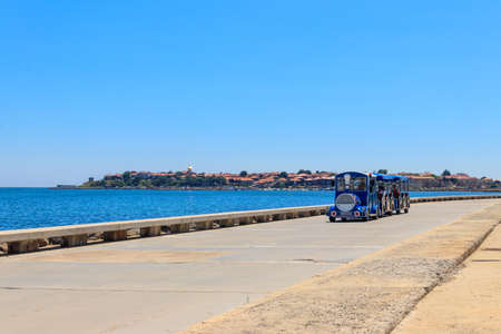 Nessebar, Bulgaria - June 30, 2021: Tourist transport in the shape of a train, carrying tourists...