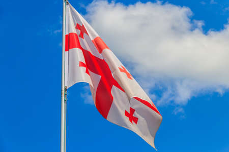 Georgian flag against blue skyの写真素材