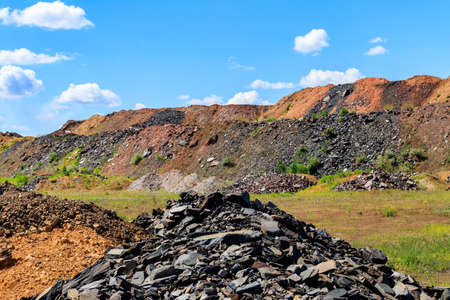 View of slag heaps of iron ore quarry. Mining industry