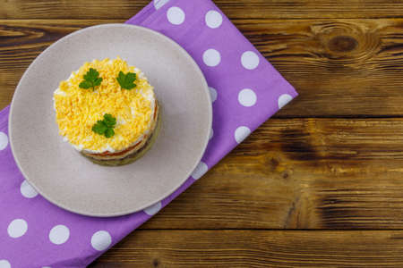 Traditional russian salad Mimosa on wooden table. Top viewの写真素材