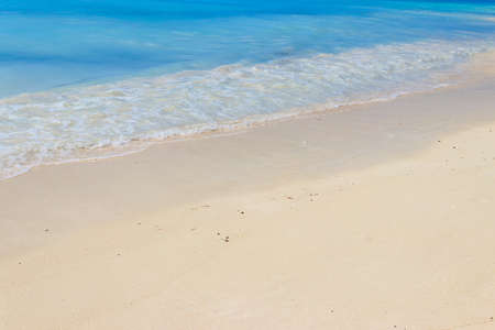 Soft wave of ocean on sandy beach