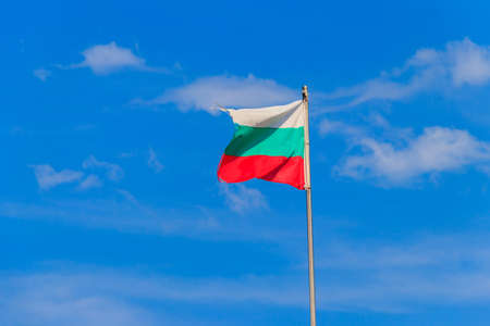 Waving flag of Bulgaria against blue skyの写真素材