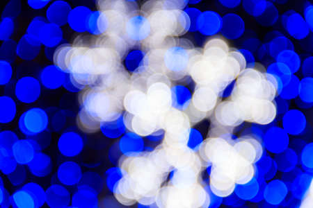 Abstract background. Blurred colorful circles bokeh of Christmas lightsの写真素材