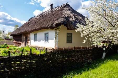 Ancient traditional ukrainian rural house in Open air Museum of Folk Architecture and Folkways of Middle Naddnipryanschina in Pereyaslav, Ukraineのeditorial素材