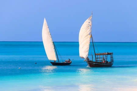 Nungwi, Zanzibar, Tanzania - September 16, 2021: View of tropical sandy Nungwi beach and traditional...