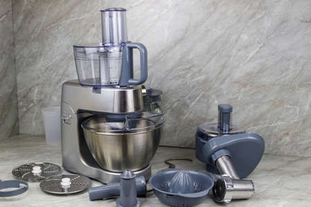 Modern kitchen machine with different attachments and accessoriesの写真素材