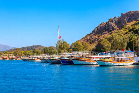 Port with tourist boats on the Mediterranean sea coast in Turkeyの写真素材