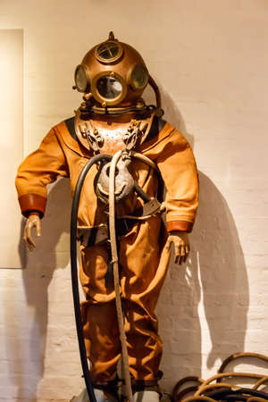 Old diving suit, bronze helmet and diving apparatusの写真素材