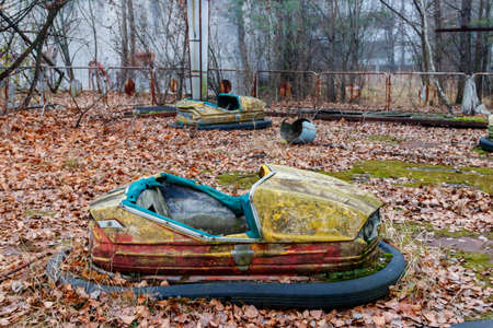 Abandoned bumper cars in the amusement park of Pripyat city in Chernobyl Exclusion Zone, Ukraineの写真素材