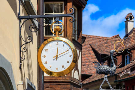 Close-up of big clock on the building in Switzerland