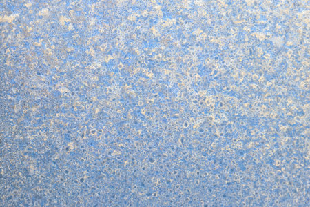 Frost pattern on a frozen window at winter. Natural background, texture
