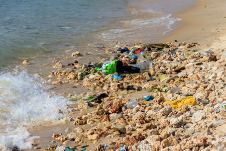 Garbage on a bank of ocean. Pollution of the sea, ocean water with waste, plastics garbage. Concept...