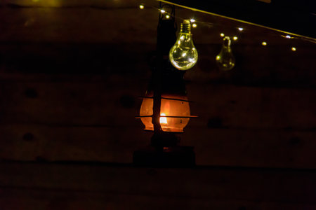 Vintage gas lamp with burning light in the nightの写真素材