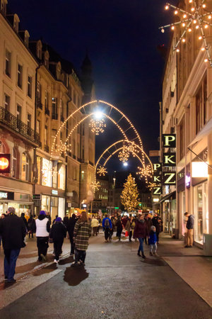 Basel, Switzerland - December 21, 2022: Night city street decorated by illumination for Christmas and New Year holidays in Basel, Switzerlandのeditorial素材
