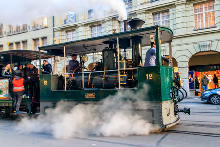 Bern, Switzerland - December 5, 2022: Vintage steam tram on street in the old town of Bern,...