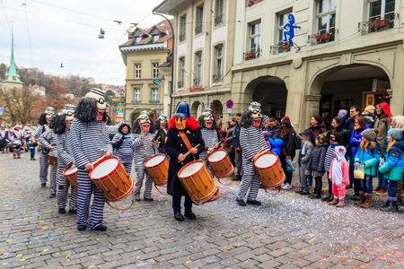 Bern, Switzerland - February 24, 2023: People marching and playing instruments during Bern carnival parade in Bern, Switzerlandのeditorial素材