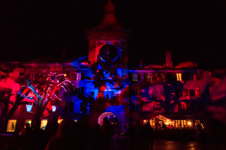 Murten, Switzerland - January 18, 2023: Brentor or Bern Gate with clock illuminated on the light festival in Murten, Switzerlandのeditorial素材