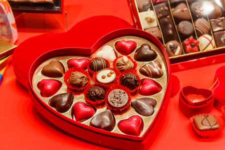 Heart shaped box of chocolate candies. valentines day conceptの写真素材