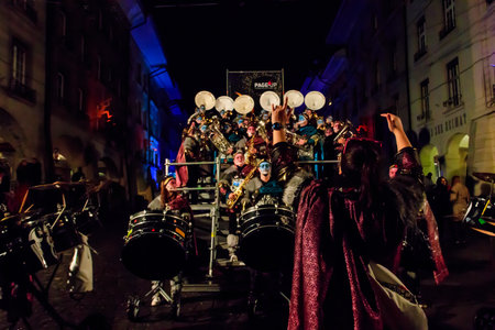 Bern, Switzerland - February 24, 2023: Guggenmusik band in costumes play to the crowd, part of the carnival of Bern, Switzerlandのeditorial素材