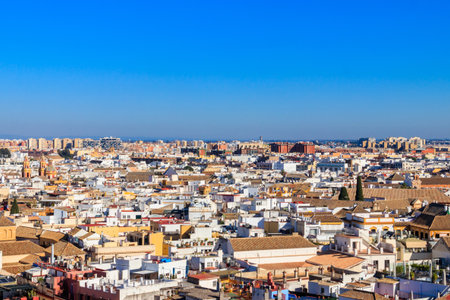 Aerial panoramic view of the old city rooftops from the Giralda Tower in Seville, Andalusia, Spain