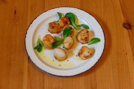 Delicious fried scallops on a tableの写真素材