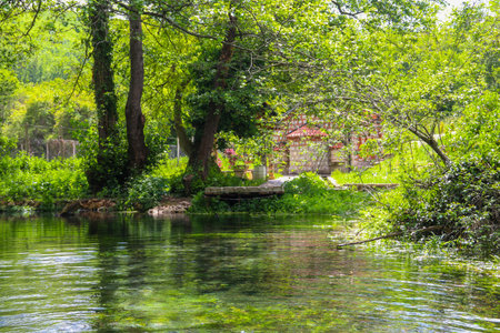 Saint Petka church near Sveti Naum monastery on Lake Ohrid, North Macedonia. Springs of the Black Dream river on a foregroundの写真素材