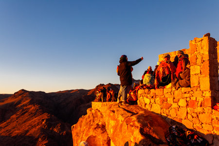 South Sinai, Egypt - January 29, 2022: People watching sunrise on the summit of Mount Sinai (Moses Mount) in Egyptのeditorial素材